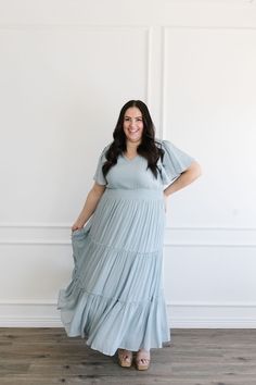 Jolene Maxi Blue V-neck Tiered Dress With Ruffle Hem, Blue V-neck Tiered Summer Dress, Blue V-neck Tiered Dress For Summer, Spring Blue V-neck Tiered Dress, Blue V-neck Tiered Dress For Spring, Blue Casual Tiered Dress With V-neck, Blue Casual V-neck Tiered Dress, Casual Blue V-neck Tiered Dress, Light Blue Short Sleeve Maxi Dress With Ruffles