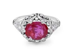 Prong-set with a 2.40 carat oval-shaped ruby, within a domed top with pierced filigree pattern, set with rose-cut diamonds, mounted in platinum. Slight chip on girdle of ruby. Oval Ruby Ring With Single Cut Diamonds For Wedding, Formal Oval Ruby Ring With Single Cut Diamonds, Elegant Oval Ruby Ring With Single Cut Diamonds, Oval Ruby Ring With Filigree, Heirloom Oval Ruby Filigree Ring, Classic Oval Ruby Filigree Ring, Oval Ruby Ring With Intricate Design, Luxury Antique Oval Ruby Ring, Luxury Ruby Ring With Oval Cabochon Diamond