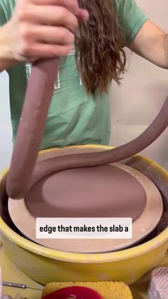 a woman is making clay in a bowl with a large wheel on the side and text that reads, edge that makes the slab a