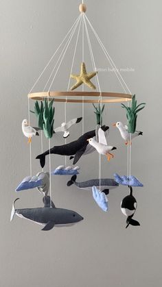 a mobile with sea animals hanging from it's sides