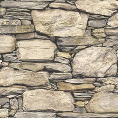 a stone wall that is made out of various types of rocks and has been used as a background