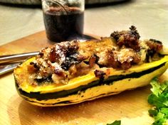 a squash is sitting on a cutting board next to some parsley