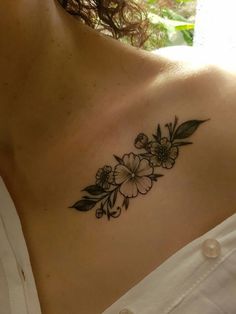 a woman's chest with flowers on it