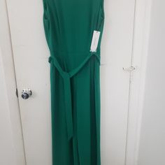 Beautiful Green Wide Leg Jumpsuit By Calvin Klein Stretch Fabric Never Worn With Tag. Fitted Calvin Klein Jumpsuits And Rompers For Party, Elegant Sleeveless Green Pantsuit, Sleeveless Belted Jumpsuit For Formal Occasions, Fitted Green Jumpsuits And Rompers With Tie Waist, Formal Belted Sleeveless Jumpsuits And Rompers, Sleeveless Belted Formal Jumpsuits And Rompers, Sleeveless Belted Formal Jumpsuit, Calvin Klein Summer Workwear Jumpsuits And Rompers, Calvin Klein Summer Jumpsuits And Rompers For Work