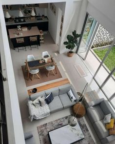 an aerial view of a living room and dining area