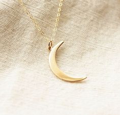 Dainty Crescent Moon Necklace♥The most tiny & dainty everyday necklace. Featuring a gorgeous golden bronze crescent moon (31x10mm) that dangles from the most delicate & shimmering gold filled chain. A gorgeous necklace that you will reach for everyday.. Necklace measure 18 inches as pictured. Completed with a round spring clasp. ♥Your purchase will come thoughtfully packaged and ready for gift giving. If this purchase is a gift that we are shipping directly to the recipient, please let me know i Elegant Everyday Crescent Charm Necklace, Elegant Brass Charm Necklace With Moon Charm, Elegant Brass Moon Charm Necklace, Half Moon Brass Necklace For Gift, Moon Necklace Gold, Necklaces Dainty, Diamond Cross Necklace Gold, Double Horn Necklace, White Diamond Necklace