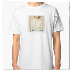 a white t - shirt with an image of a woman's face