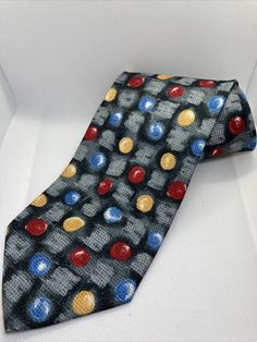 Pre Owned  Clean with minimal signs of wear (see photos)  Info: Mens Tie  Designer: Daniel Valente  Gray with multicolor circles and patterns (see photos)  Materials: 100% Polyester  56 L X 3.5 W (widest part of the tie)  Review all Photos  Free Shipping via USPS with Tracking and Delivery Confirmation  Free Local Pickup  Suncoast Treasures Policies:  Returns: A 20% restocking fee will be added at the buyer’s cost. All returns must be completed within 30 or 60 days from the date of delivery stat Vintage Multicolor Business Ties, Classic Multicolor Office Ties, Multicolor Office Ties, Multicolor Vintage Ties, Ties Mens, Floral Tie, See Photo, Neck Tie, Grey