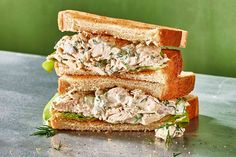 two halves of a chicken salad sandwich stacked on top of each other