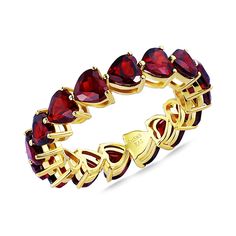 a gold ring with red stones on it