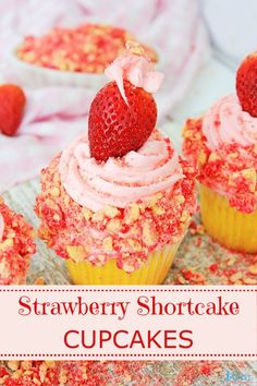 strawberry shortcake cupcakes with pink frosting and sprinkles on top