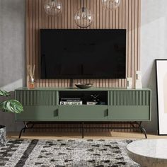 a living room with a large television on the wall