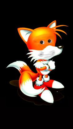 an orange and white fox sitting on top of a black surface with its tail curled up