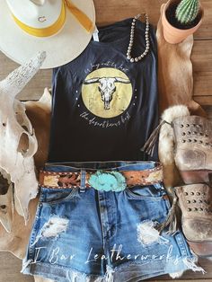 "Such a fun tank! Featuring a cowskull design with \"Way out west the desert knows best\" wording Flowy scoop neck muscle tank 3.7 oz./yd² (US) 6.2 oz./L yd 65polyester/35/viscose Relaxed, drapey fit Low-cut armholes Curved bottom hem Side seams Midnight color tank Please see size guide in pictures." Western Tank Top Outfit, Rodeo Outfits For Women Summer, Fitted Tank Top For Rodeo In Summer, Fitted Western Style Sleeveless Tank Top, Fitted Tank Top For Summer Rodeo, Cute Western Tank Tops, Nashville Outfit, Stagecoach Outfit, Western Tank Tops