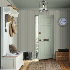 an entryway with a clock on the wall