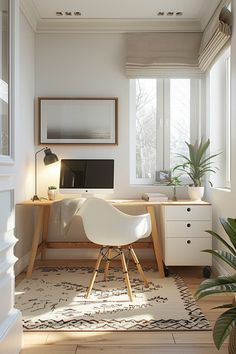 a room with a desk, chair and computer on the floor next to a potted plant