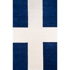 a blue and white rug with a cross on it