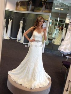 a woman taking a selfie in her wedding dress