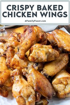 crispy baked chicken wings on a white plate with text overlay that says crispy baked chicken wings