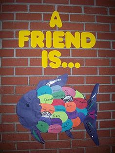 a brick wall with an image of a fish and the words a friend is on it