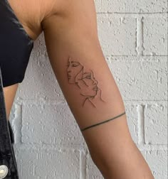 a woman with a tattoo on her arm