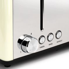 a close up of a toaster oven with buttons on it's knobs