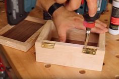 a man is working on some wood with a drilldriver and screwdriver