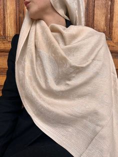 Presenting our "Ivory Elegance Pashmina Scarf" - an epitome of sophistication and refinement. This luxurious scarf features a delicate ivory hue that exudes timeless elegance. Crafted from premium-quality fabric, it offers unmatched softness and warmth, enveloping you in comfort throughout the day. With its intricate paisley design and subtle shimmer, this pashmina scarf adds a touch of glamour to any ensemble. Versatile and stylish, it can be draped in various ways to suit your personal style. Day Before Wedding, White Pashmina, White Hijab, Shawl Wedding, Evening Shawls, Hijab Style Tutorial, Pashmina Shawl, Clothes Aesthetic, Pashmina Scarf