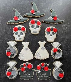 decorated cookies are arranged in the shape of witches and skeletons with red roses on their heads