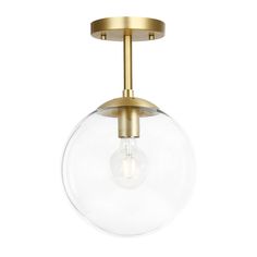 a light fixture with a glass globe on the bottom and a gold metal frame around it