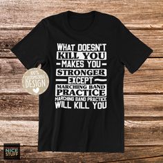 a black t - shirt that says what doesn't kill you makes you strong