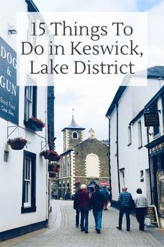 people walking down a cobblestone street with the words 15 things to do in keswick, lake district