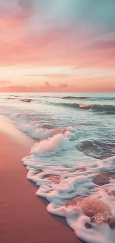 the sun is setting over the ocean with waves coming in to shore and sand on the beach