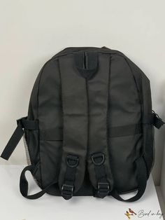 a black backpack sitting on top of a table