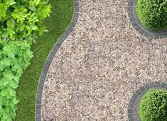 an aerial view of a paved walkway surrounded by grass