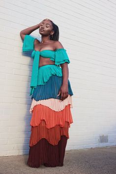 The Sunset in Malibu two-piece chiffon set comes with a semi-sheer crop top that has an off-the-shoulder neckline, ruffle trim, short bell sleeves, and a knotted self-tie back, and an accordion-pleated maxi skirt with tiered multicolor panels, and a concealed back zipper. Composition: Rayon Pleated Ruffle Skirt Hidden back zipper Color: Deep brown Model is 5’9 and is wearing a size US Small This style fits true to size Tiered Pleated Skirt, Tiered Skirt Outfit, Ruffle Skirt Outfit, Cruise Style, Short Bell Sleeves, Color Outfits, Sheer Crop Top, Tiered Ruffle Skirt, Tiered Maxi Skirt