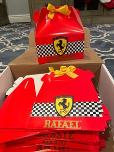 several ferrari themed boxes are stacked on top of each other