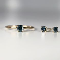 "14k yellow gold and blue diamond stud earrings. They will make a great companion to your beautiful wedding. They are very elegant for daily use or for official gatherings. SOLD AS PAIR. Material; 14k solid gold studs Round blue diamonds are 3mm Prong settings. 14k gold backings included. On the pictures you see 14k solid gold hammered bar studs are available from this link; https://www.etsy.com/listing/953435550/14k-gold-hammered-bar-stud-earrings-tiny? Matching ring is available here https://w Blue 14k Gold Earrings For Wedding, Wedding Rings In Yellow Gold With Matching Earrings, Yellow Gold Wedding Rings With Matching Earrings, 14k Yellow Gold Solitaire Earrings, Blue Diamond Earrings, Stud Earrings Diamond, Blue Diamonds, Bar Stud Earrings, Matching Ring