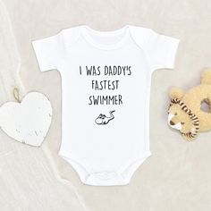 Funny Baby Onesie Unique Baby Clothes I Was Daddy's Fastest Swimmer Baby Onesie Baby Shower Gift Funny Baby Clothes HOW TO ORDER:1) Choose onesie2) Select design color if applicable3) Enter customization in “Add your personalization” field4) ADD TO CART5) Select from our shipping class optionsONESIE SIZES0-3 Months :: 21-24 in. / 6-12 Ibs.3-6 Months :: 24-26 in. / 12-16 Ibs.6-9 Months :: 26-28 in. / 16-20 Ibs.12 Months :: 28-30 in. / 20-24 Ibs.PERSONALIZATIONIF the item includes personalization, Funny Onsie Ideas, Auntie Baby Clothes, Aunt Baby Clothes, Baby Clothes Funny, Crafts 2024, Onesie Ideas, Auntie Baby, Funny Baby Onesie, Funny Baby Gifts