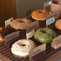 there are many different donuts on display