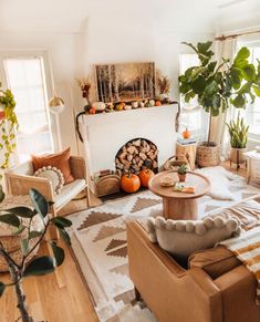 a living room filled with furniture and a fire place next to a window covered in greenery