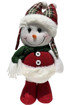 a stuffed snowman wearing a santa hat and scarf