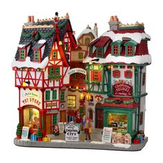 a christmas village with many buildings and lights