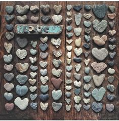 several different types of rocks arranged on a wooden surface