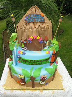 a birthday cake for someone's 21st birthday on a table in front of some grass