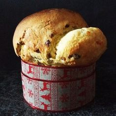 a loaf of bread sitting in a red and white container