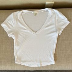 White Ribbed V-Neck Crop Top Tee Shirt Never Worn - This Too Is A Fitted Top Size Medium - Tag Pictured With Type Of Material Shirt Made Of. White V Neck Crop Top, Fitted White Shirt, 2024 Clothes, White Crop Tops, V Neck Crop Top, Cropped Shirts, Tshirt For Women, Christmas Inspo, Quick Outfits