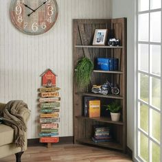 a living room filled with furniture and a large clock on the wall above it's bookshelf