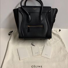 100% Authentic Celine Micro Luggage Handbag In Smooth Calfskin In Black. Only Used It Couple Of Times. Will Comes With A Dust Bag. Will Record Shipment Process For Both Of Our Protection. **Product Details**11 X 11 X 6 In (27 X 27 X 15 Cm)Calfskinlambskin Lininggold Metal Hardwarehand Carryzipped Closure Inner Zipped Pocket And Double Flat Pocket Outer Zipped Pocket On Fronthandles With 5 In (12 Cm) Dropprotective Studs On Base **Come From A Smoke Free/Pet Free Home*** Celine Micro Luggage, Celine Micro, It Couple, Black Only, Celine Bags, Celine Luggage Bag, Celine Bag, Womens Tote Bags, Calf Skin