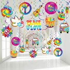 a room filled with lots of colorful decorations and balloons in the shape of peace signs